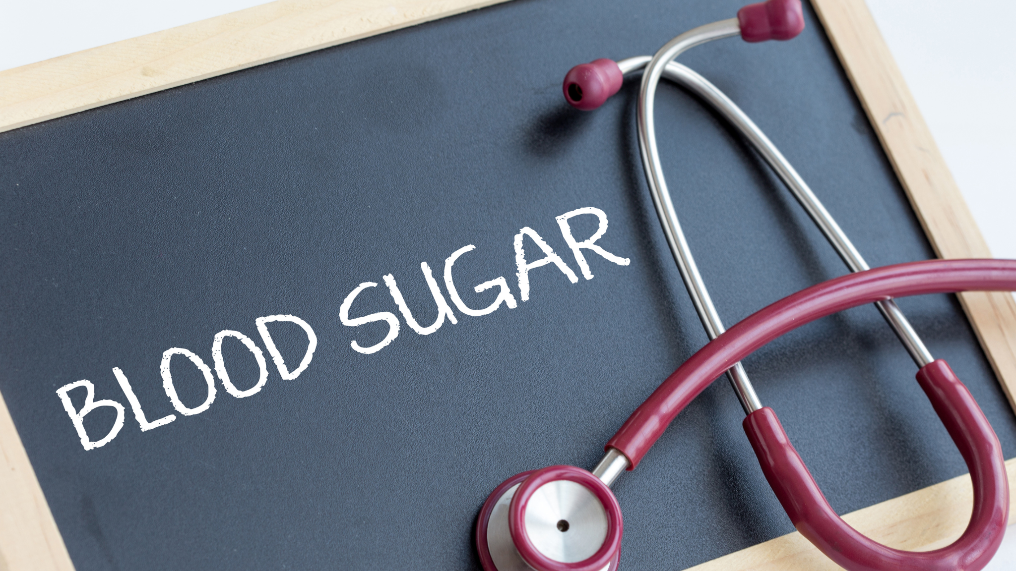 chalk board with the words Blood Sugar written on it and a stethoscope wrapped around it - for the blog Benefits of Weightlifting on Blood Sugar on the Hope Health and Wellness Advocacy website