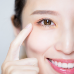 female pointing to one of her eyes for the Hope Health and Wellness Advocacy blog - Vitamin C: Everything You Need and Want To Know Especially During Respiratory Virus Season
