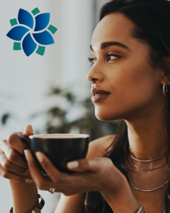 a young pretty woman is holding a cup that looks like it probably has coffe or hot tea in it as she looks off in the distance - for the blog on mindfullness on the website Hopehwa.com for Hope Health and wellness Advocacy and Coaching